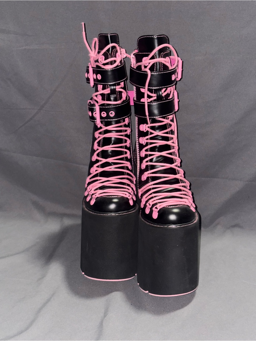 Extra tall pink and black platform traitor boots